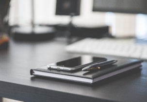 smartphone-diary-and-silver-pen-on-black-workspace-desk-picjumbo-com